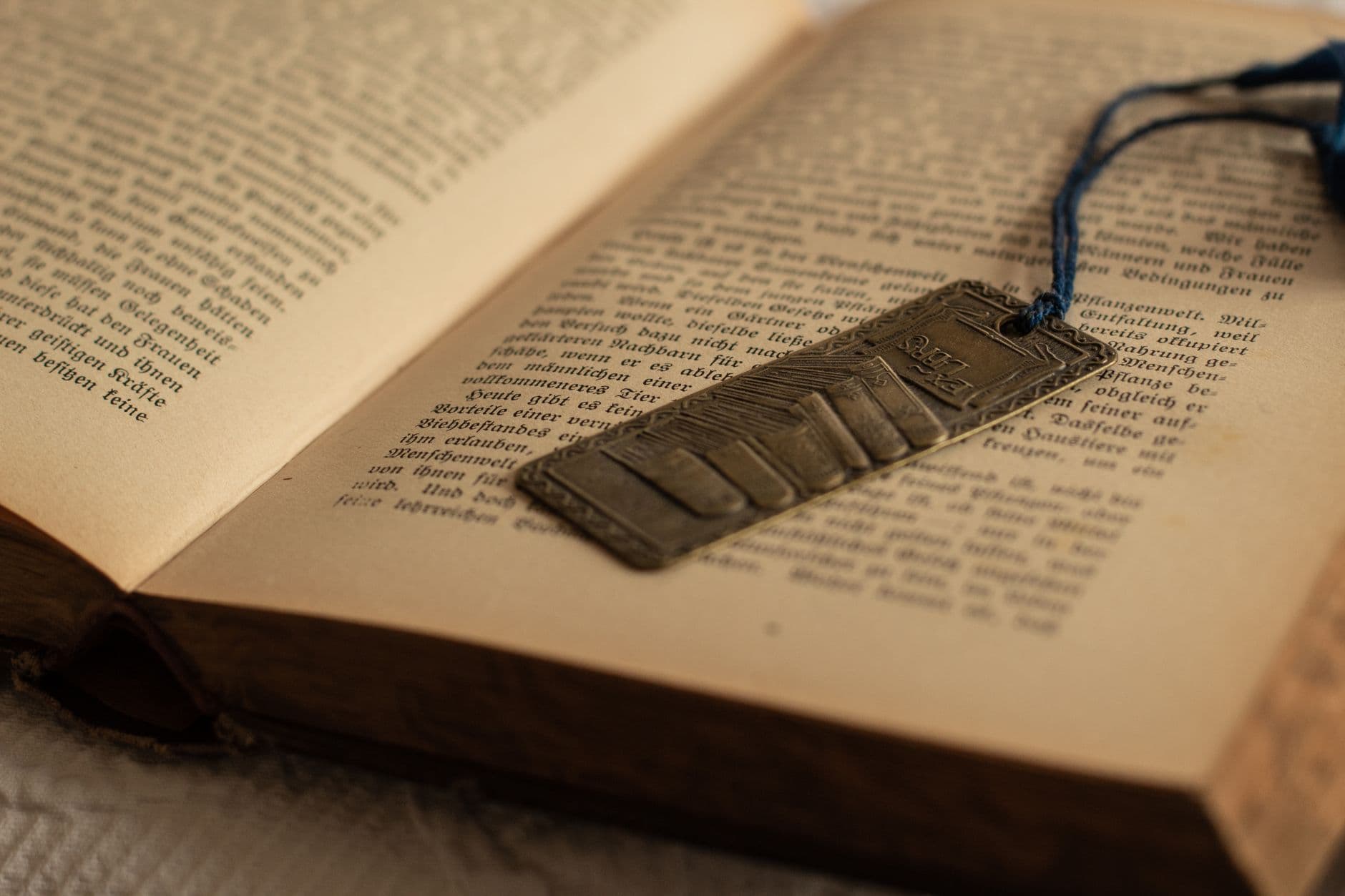 A bookmark resting between the pages of an open book