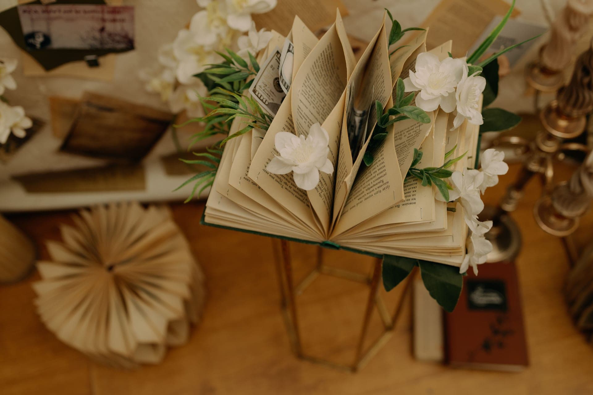An open book propped upright on a wooden stand