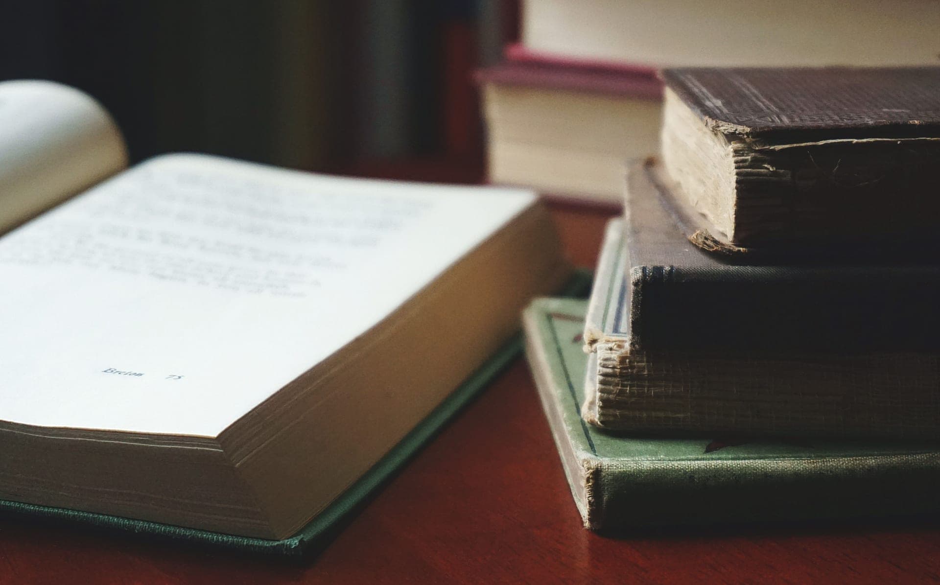 A hardcover book with its dust jacket resting on a table
