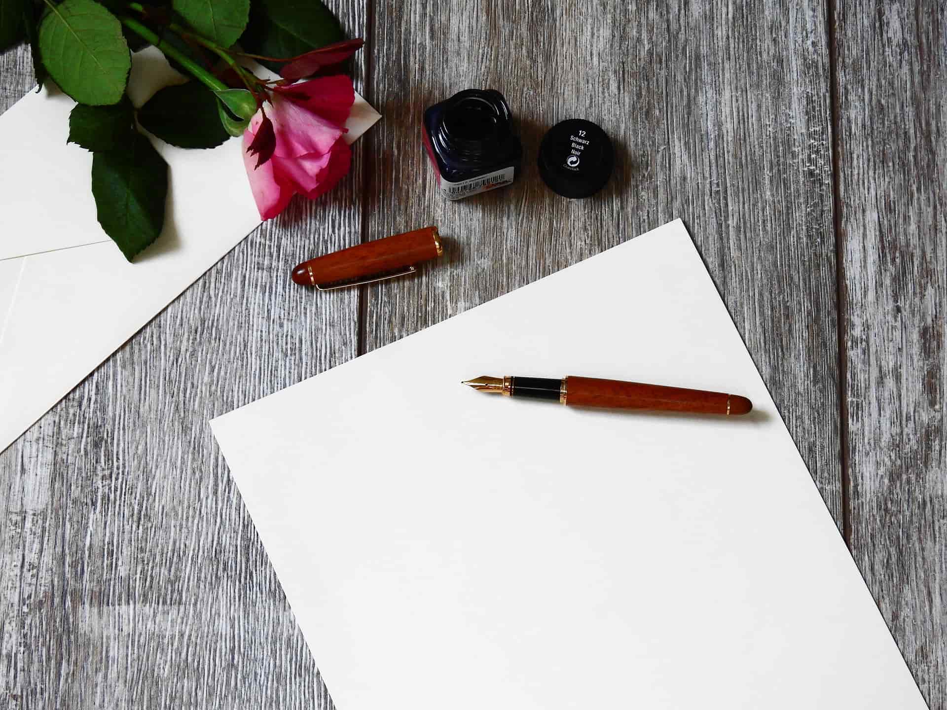 Writing a letter at a wooden desk