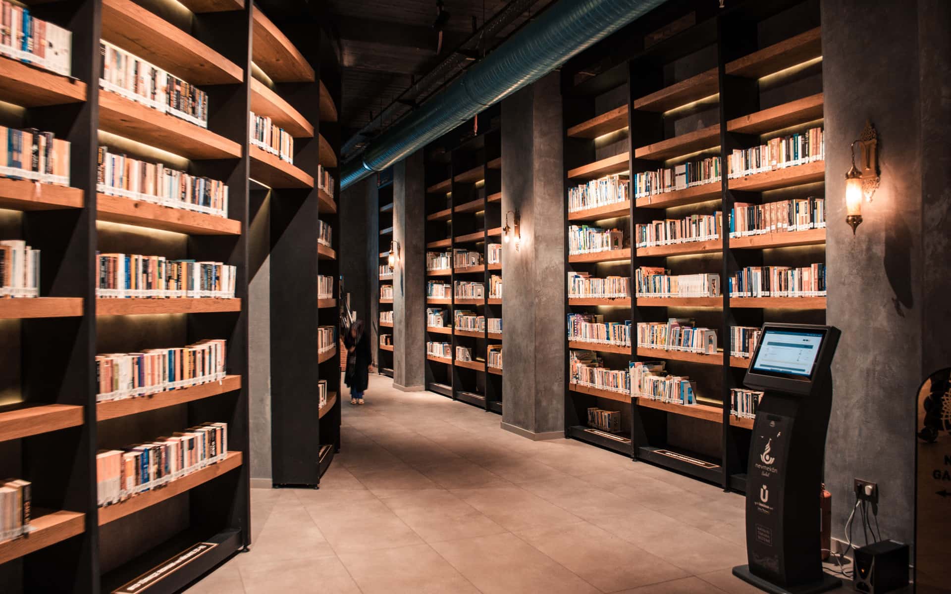 Quiet library shelves receding into the distance