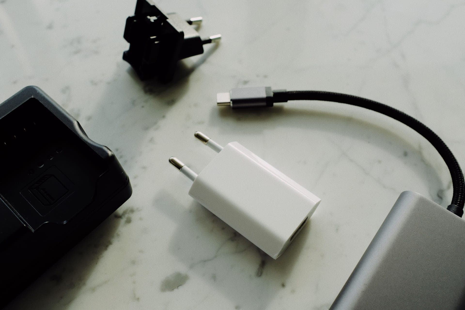 A USB charging cable coiled on a bedside table